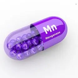 Illustration d'une gélule violette portant le symbole Mn du manganèse