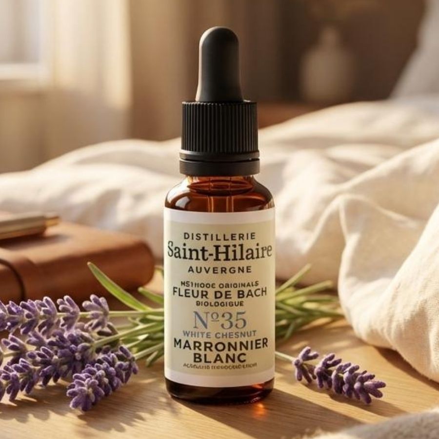 Un flacon de 20ml de fleur de bach marronier blanc posé sur une table en bois.