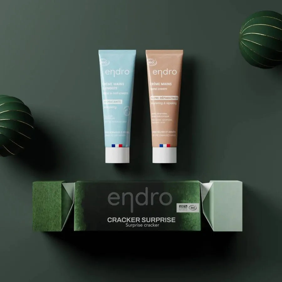 Coffret crakers surprise de la marque Endro comportant deux produits sur fond vert.