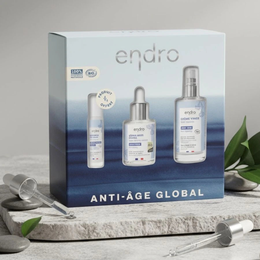 Coffret de soins Endro "Anti-Âge Global" contenant le Sérum, la Crème Visage et le Contour des Yeux offert. Les produits sont mis en évidence sur un fond blanc.