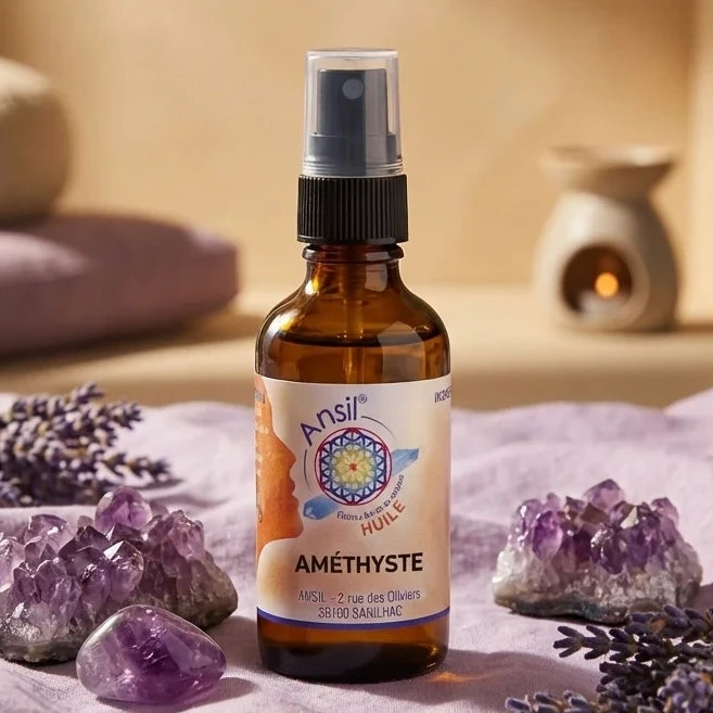 Huile de cristal Améthyste Ansil 50ml en flacon ambré sur tissu lavande avec cristaux