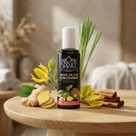 Aromaspray Bois de Hô & Gingembre 100 ml entouré de gingembre frais, bâtons de cannelle et fleurs ylang-ylang