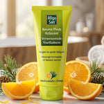 Gros plan sur Baume pieds relaxant Allga San 100ml sur surface marbre avec agrumes et branches de pin