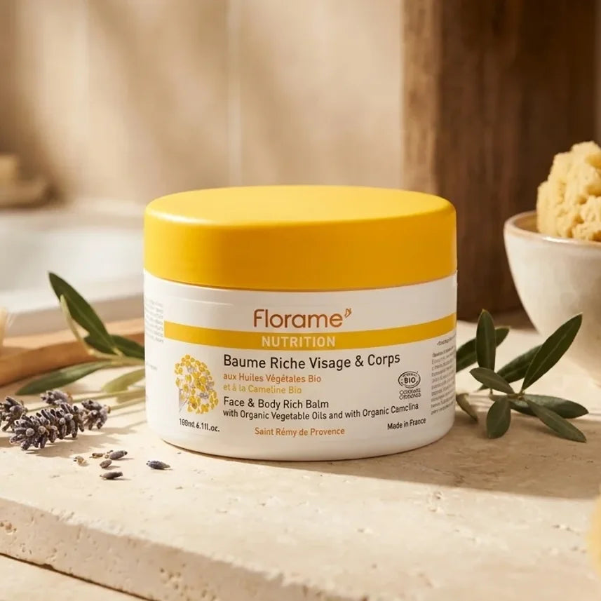 Baume Riche Florame 180ml bio visage et corps en pot avec couvercle jaune sur surface naturelle