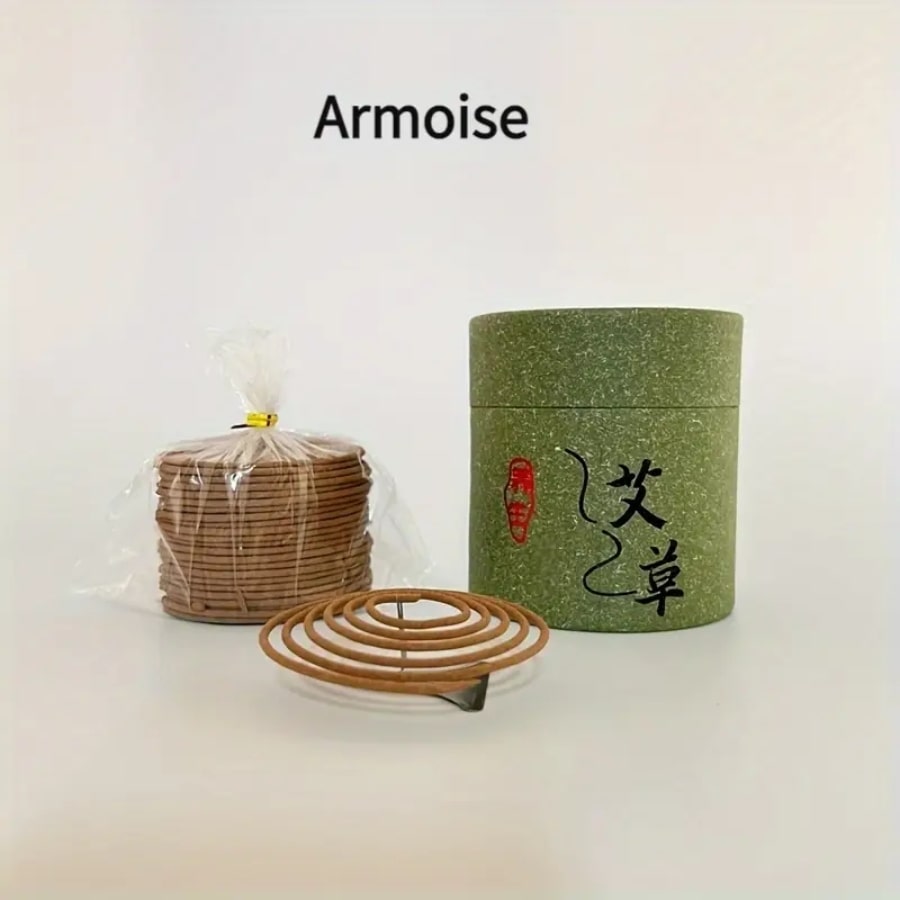 Une boîte d'encens à l'armoise avec un pack de bobine et une spirale sur un socle