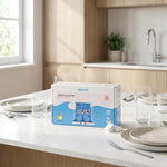 Boîte Pimpant 40 doses tablettes lave-vaisselle sur comptoir cuisine avec assiettes propres