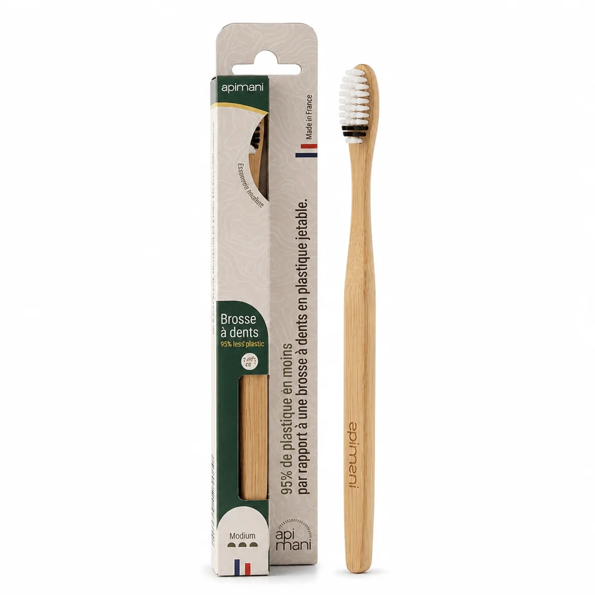 Brosse à dents en bois Apimani medium avec poils blancs, emballage vert écologique 95% moins de plastique