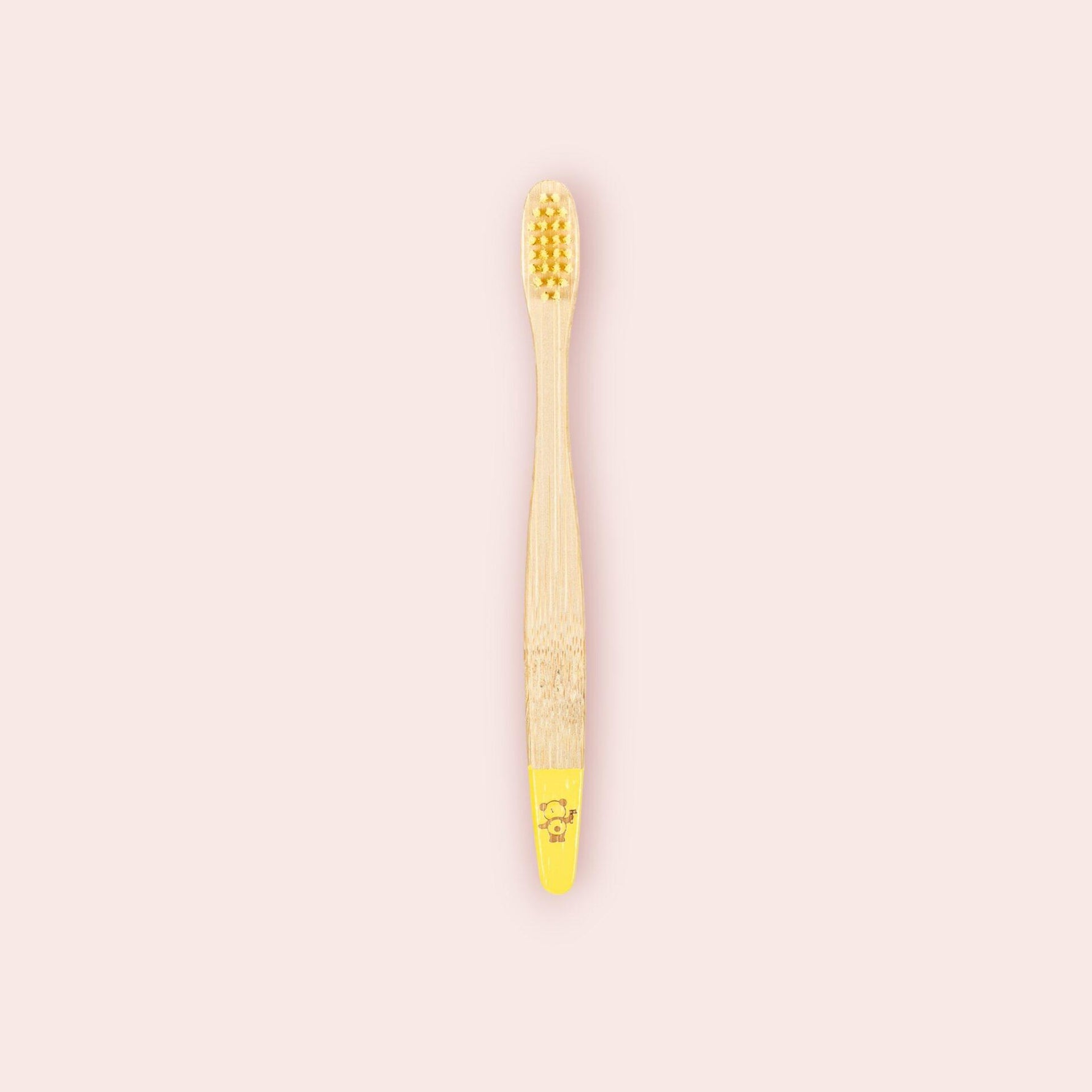  Une brosse à dents enfant jaune de la marque Cap Bambou