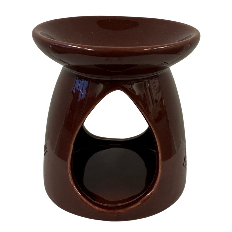 Bruleur de cire parfumée couleur bordeaux sur fond blanc vue de face.