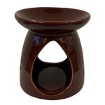 Bruleur de cire parfumée couleur bordeaux sur fond blanc vue de face.