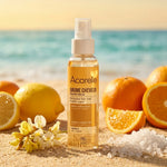 Brume Protectrice Cheveux Acorelle 100ml sur plage avec fruits citrus et fleurs botaniques