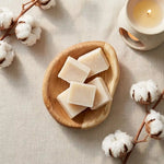 Carrés fondants Fleur de Coton HomeBreeze sur plateau bois, diffusion de parfum d'ambiance