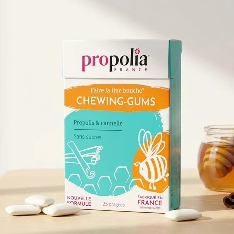 Chewing-gums sans sucre Propolia Propolis Cannelle 25 dragées sur bureau avec pot de miel