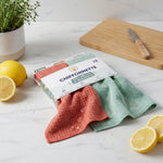 Chiffonettes lavables Anotherway lot de 2 corail et menthe sur plan de travail cuisine