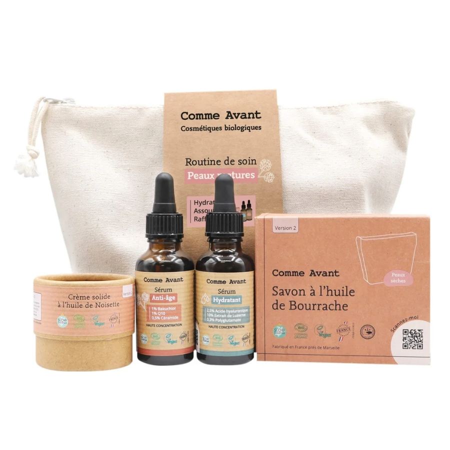 Coffret routine anti-âge pour peaux matures, contenant une crème solide à l'huile de noisette, un sérum hydratant, un sérum anti-âge, un savon à l'huile de Bourrache, et une trousse blanche