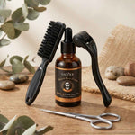 Un kit de soin de la barbe comprenant une huile, un roller, une brosse et une paire de ciseaux à barbe