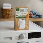 Un pack de coussinet absorbant de couleur polarity wash posé sur une machine à laver