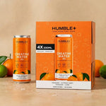 Créatine Water Humble+ 330ml en packaging avec fruits et gouttes d'eau sur fond neutre