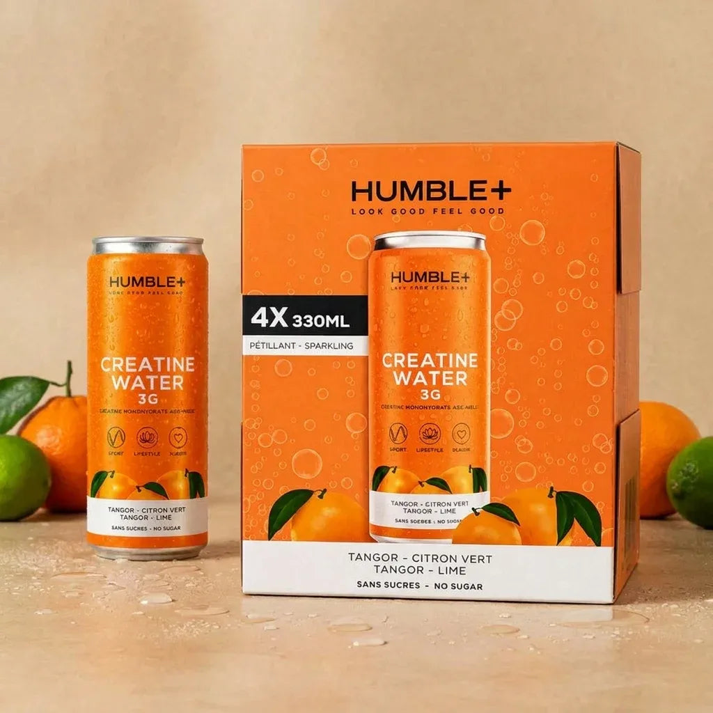 Créatine Water Humble+ 330ml en packaging avec fruits et gouttes d'eau sur fond neutre