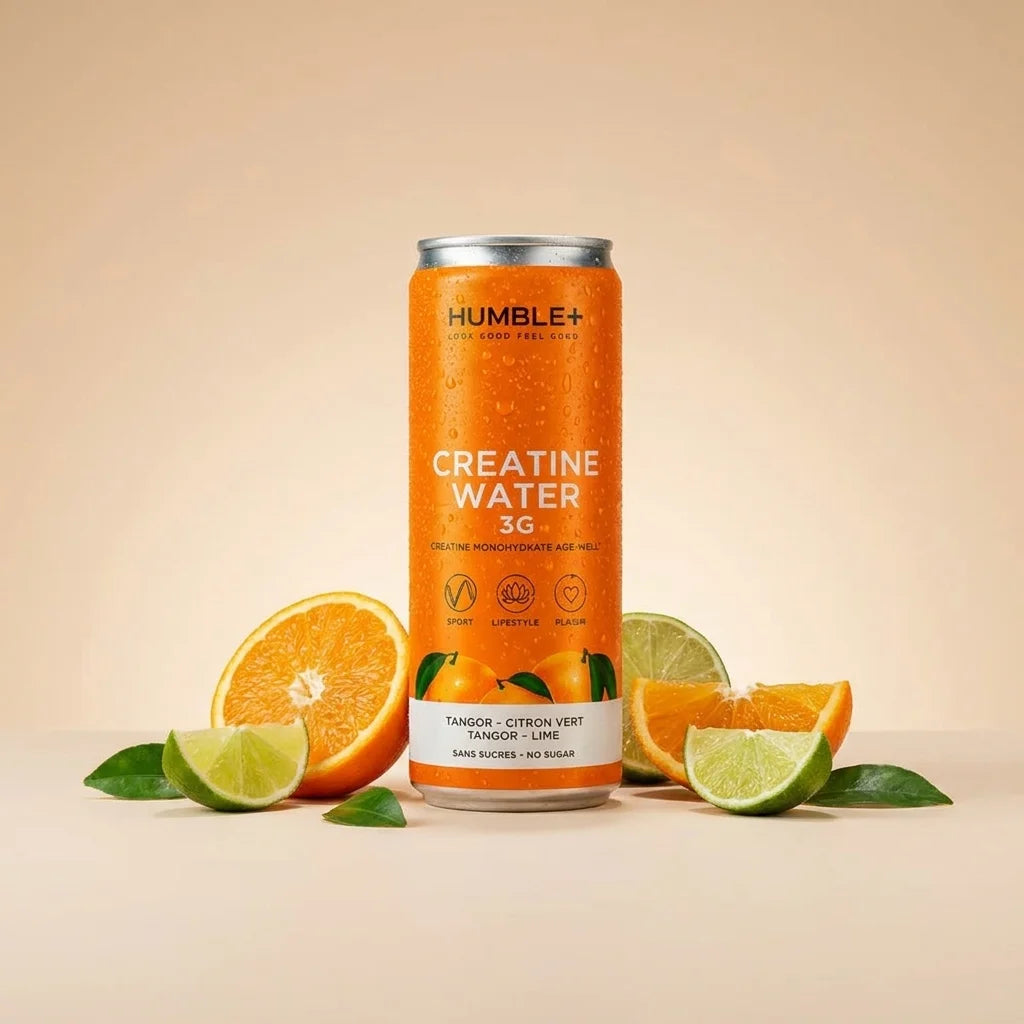 Créatine Water Humble+ 330ml saveur tangor-lime avec fruits frais en arrière-plan