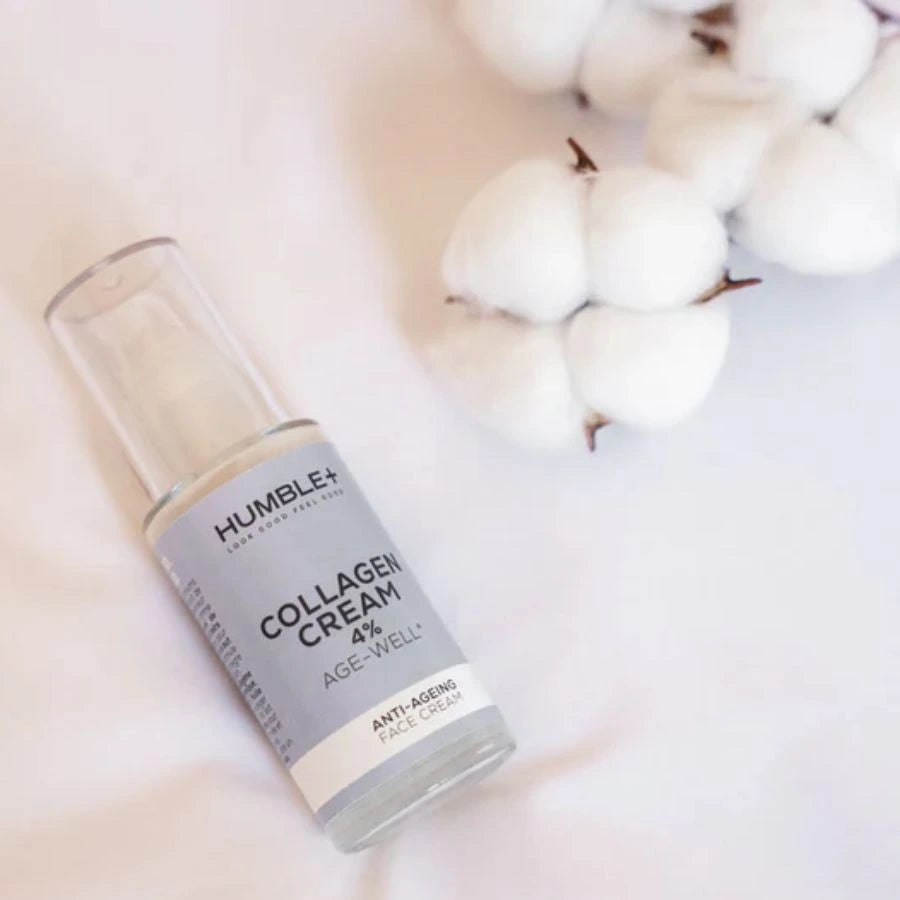 un flacon de crème anti-âge au collagène marin de la marque Humble + posé à côté d'une branche de de coton