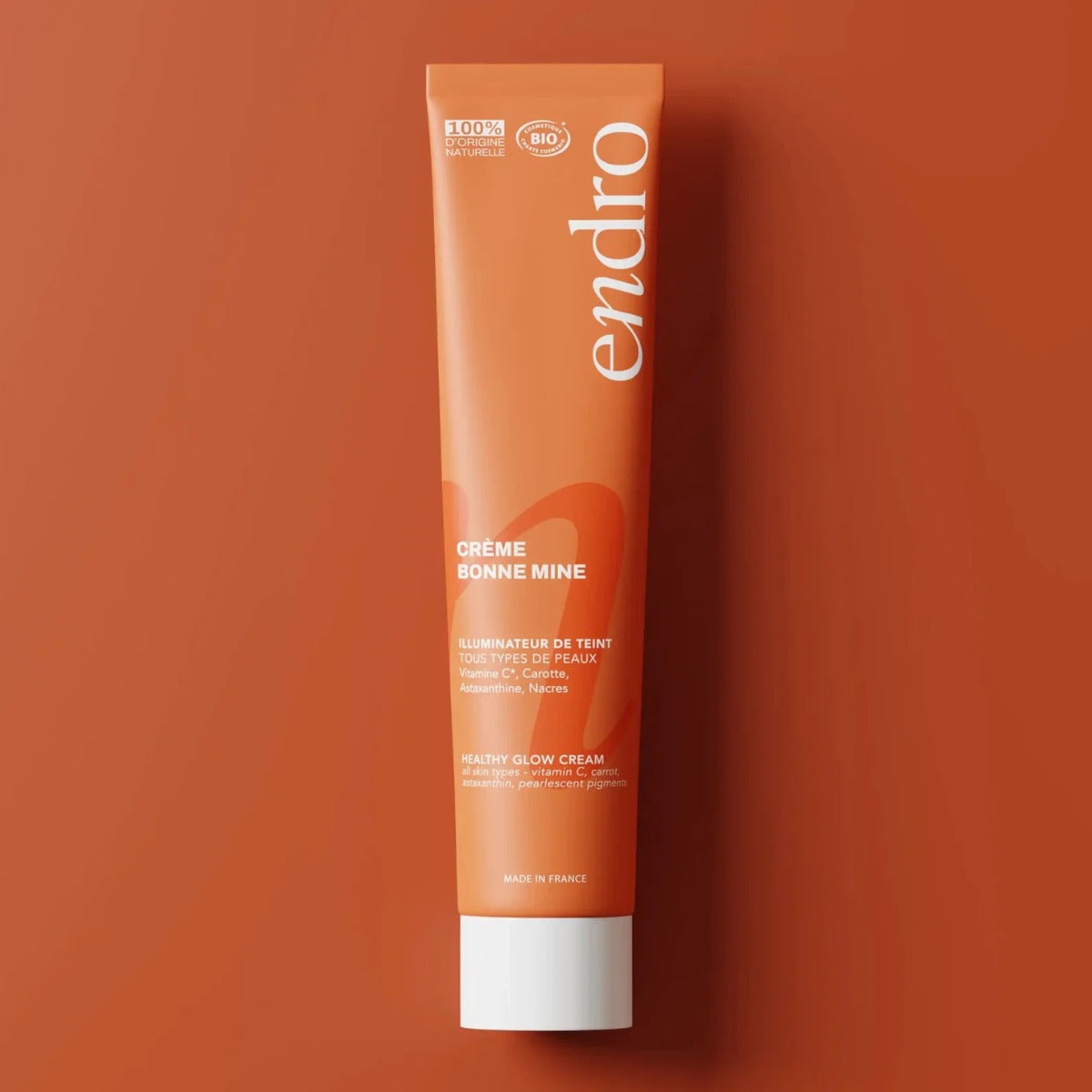 Crème bonne mine visage Endro sur fond orange