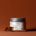 Un pot de crème visage bonne mine de la marque endro avec une paire de lunettes de soleil