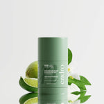 Déodorant stick Endro Fraîcheur Végétale entouré de citron vert et de feuilles, pour évoquer une senteur fraîche et végétale.