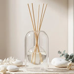 Diffuseur de parfum bâtonnet en verre soufflé avec tiges en rotin naturel, style minimaliste luxe
