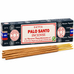 Boîte d'encens Satya Palo Santo bleu marine avec étiquette crème, bâtonnets d'encens sur fond blanc, format 15 g