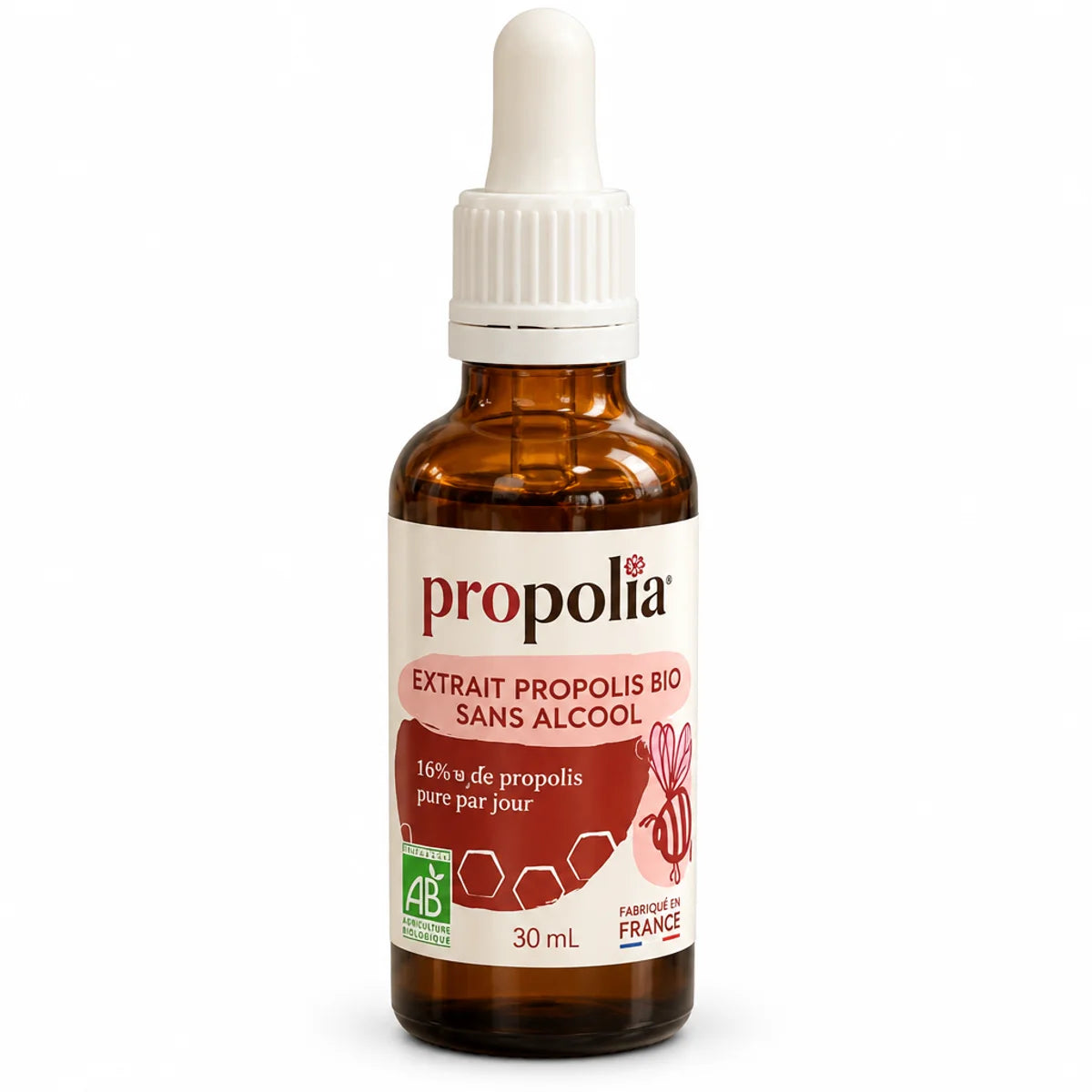Flacon en verre ambré avec pipette blanche et étiquette Propolia « Extrait de propolis brune bio sans alcool 30 mL » sur fond blanc