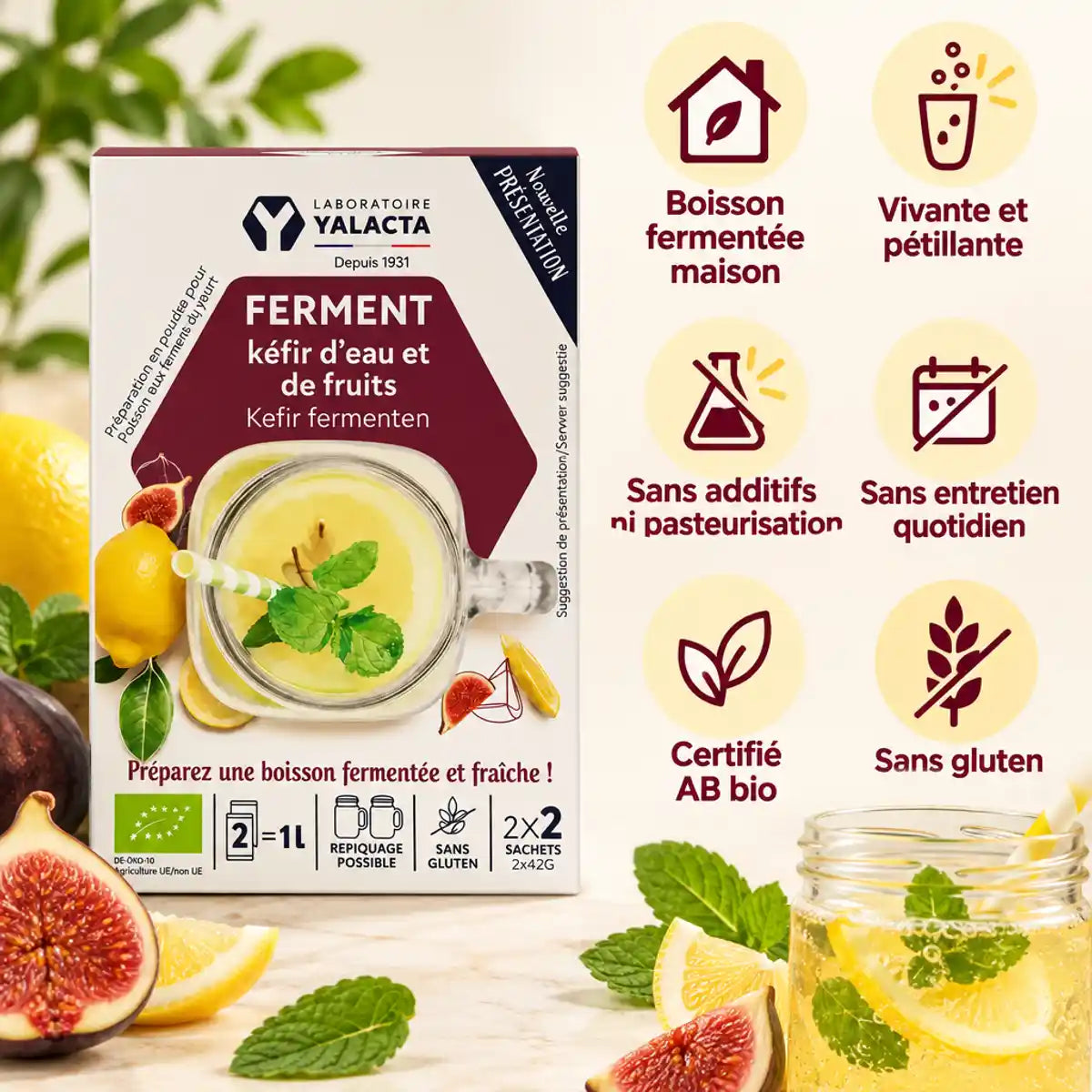 Ferment kéfir d'eau et fruits bio Yalacta, boîte entourée de citrons, figues et menthe, bocal de kéfir pétillant