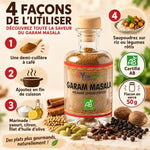 Garam Masala bio AyurVana 50 g en flacon de verre, entouré d'épices entières, avec guide d'utilisation en 4 étapes sur fond crème.