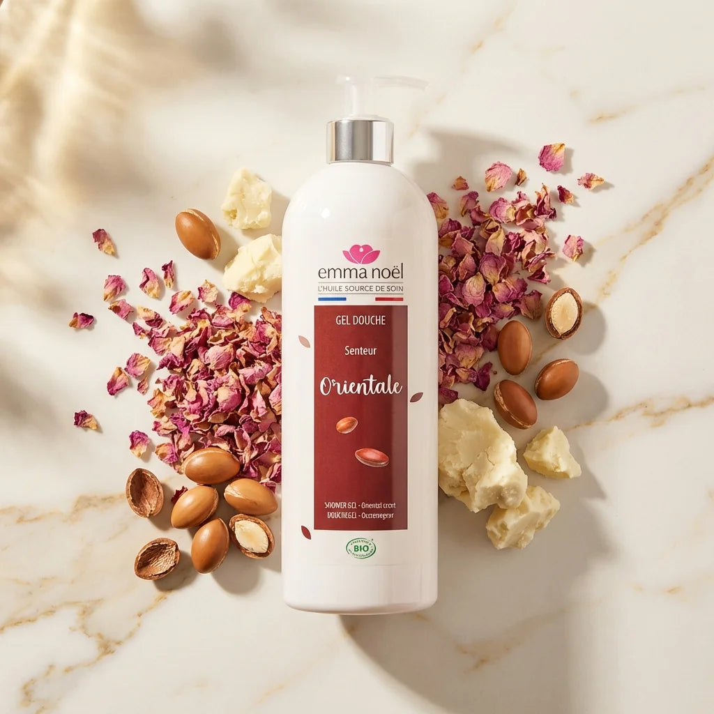 Gel douche argan bio Emma Noël 1L avec pompe sur marbre, argan et pétales roses