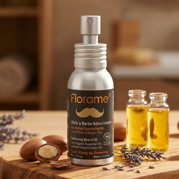 Huile à barbe bio Florame 50ml avec noix d'argan sur surface en bois, ambiance spa luxe