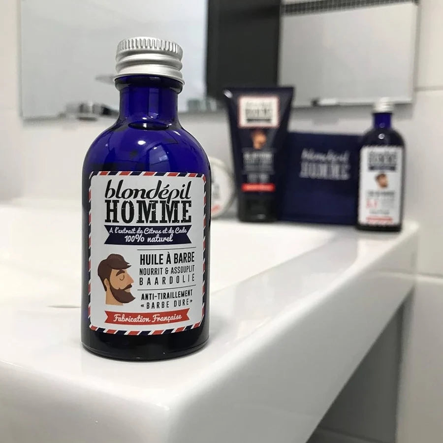 un flacon d'Huile à barbe bio 50ml de Blondépil Homme posé sur un meuble vasque