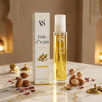 Huile d'Argan Bio 100ml Arc en Sels avec noix d'argan et fleurs séchées sur marbre
