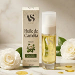 Huile de Camélia Bio Arc en Sels 30ml avec fleurs blanches et feuilles vertes sur marbre