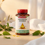 Flacon Superdiet Huile de Foie de Morue 120 capsules sur fond wellness avec feuilles vertes