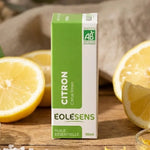 Huile essentielle citron bio 10ml Eolesens avec citrons frais et feuilles vertes