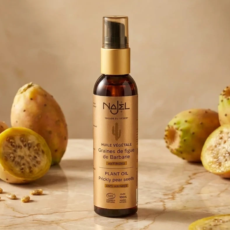 Huile végétale de graines de figue de Barbarie Bio Najel en flacon ambré avec fruits frais