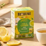 Infusion citron doré Biohême bio avec tasse de thé fumant et tranches de citron frais au soleil