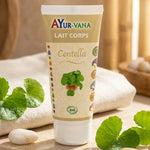 Lait Corps Centella Bio 75ml Ayur-Vana sur fond spa avec feuilles et pierres naturelles