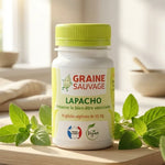 Flacon Lapacho 60 gélules Graine Sauvage sur surface bois avec feuilles vertes naturelles
