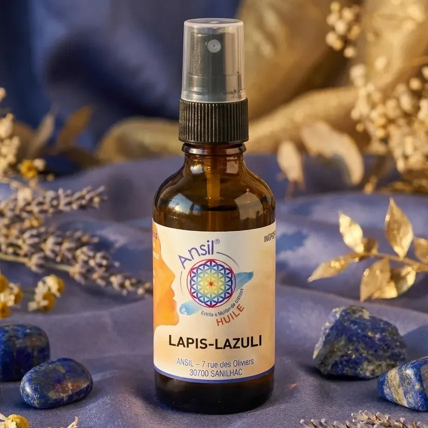 Huile de cristal Lapis-Lazuli Ansil 50ml avec cristaux et botaniques sur fond wellness doré