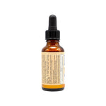 Le verso d'un flacon d'huile pailletée corps et visage de 30ml de la marque Comme Avant