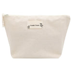 La pochette de toilette en coton bio Comme Avant, offerte avec le coffret