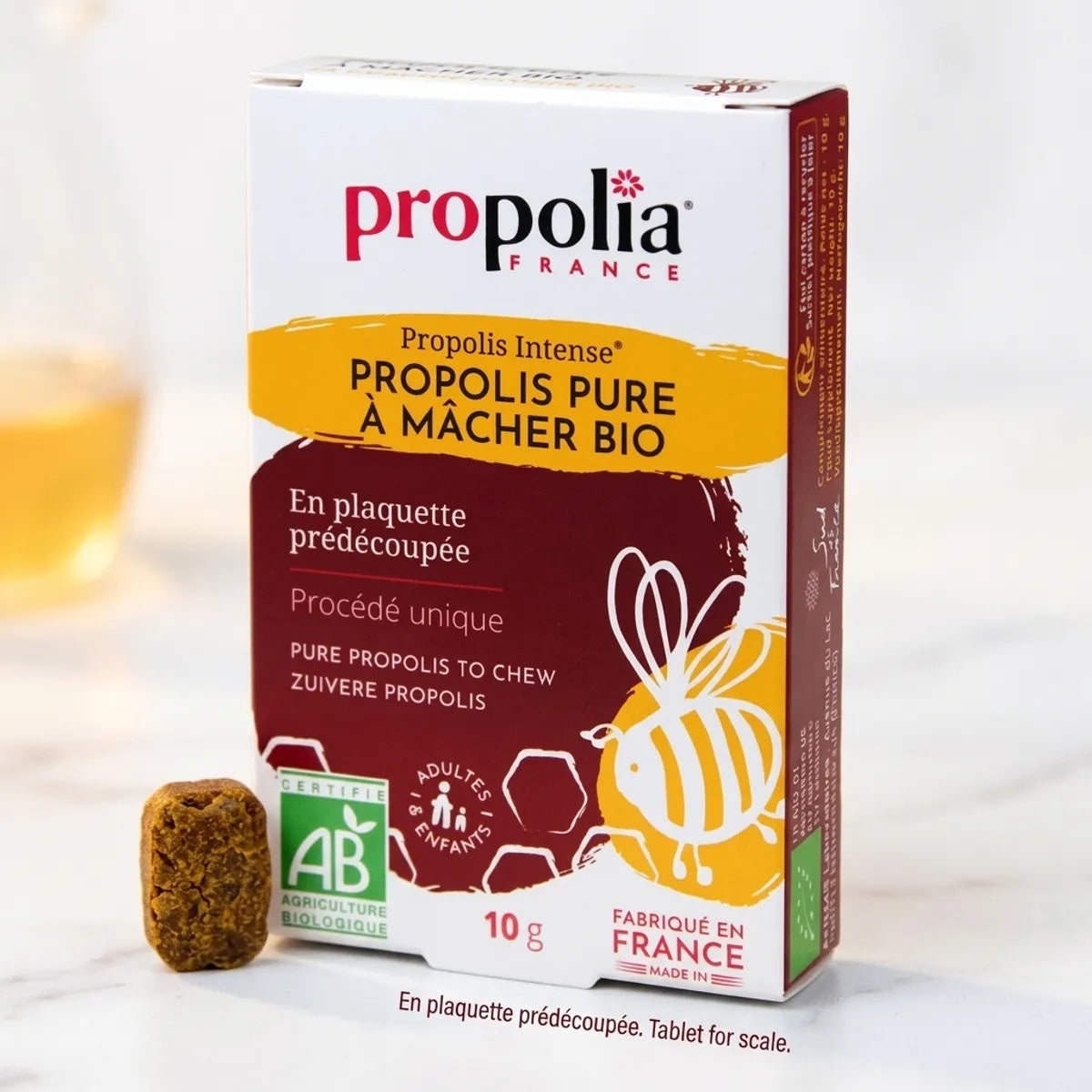 Propolis Pure à Mâcher Bio Propolia - comprimé et emballage sur surface blanche