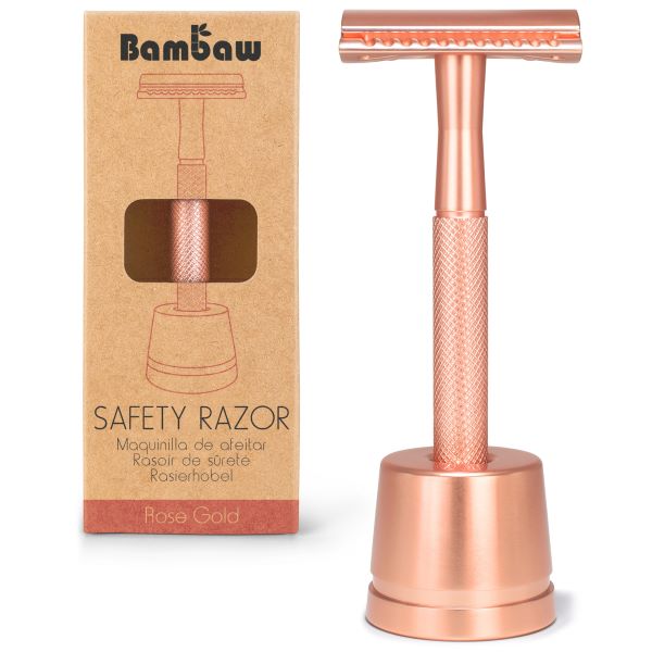Un. rasoir de sûreté en métal avec socle, couleur or rose, de la marque Bambaw
