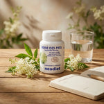 Reine des prés 100 gélules Vital Osmose bouteille blanche sur table bois avec fleurs